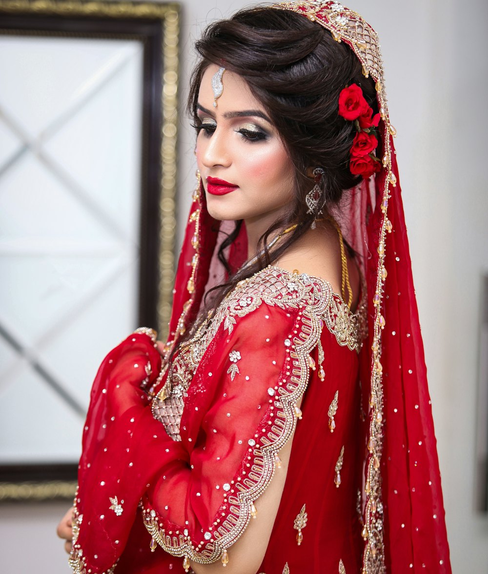 Bridal portrait in red and gold lehenga